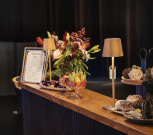 Mobile Bar in Houston at a Corporate event. Elegant bar setup with floral arrangements.