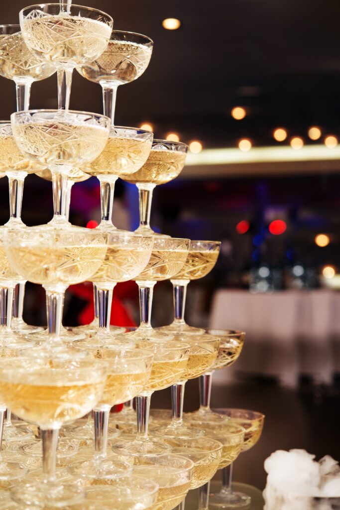 Champagne tower with coupe glasses for a Houston wedding reception toast