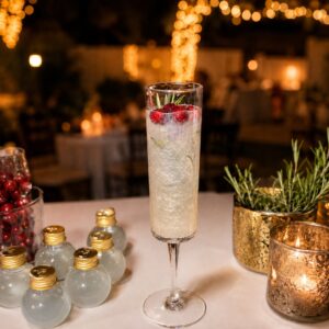 glitter and interactive Christmas champgagne cocktail flute with cranberry and rosemay 1