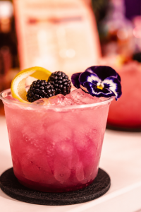 Blackberry Mocktail | I’ll Drink To That! Blackberry mocktail served over ice with fresh blackberries and an orange twist