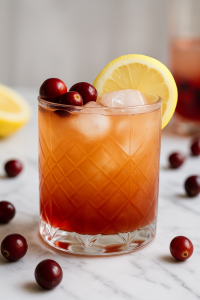 Cranberry Whiskey Vibes cocktail made with cranberry, whiskey, pineapple, lemon, and simple syrup, served over ice and garnished with fresh cranberries and a lemon wheel from I’ll Drink To That! mobile bar.