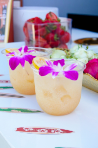 A refreshing pink mocktail made with fresh guava, coconut cream, lemon, and sparkling club soda, garnished with citrus and served over ice.