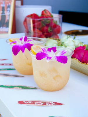 A refreshing pink mocktail made with fresh guava, coconut cream, lemon, and sparkling club soda, garnished with citrus and served over ice.