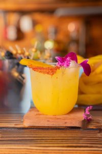 Mango Joy – Fresh & Fruity Mocktail by I’ll Drink To That! Mobile Bar Vibrant Mango Joy mocktail or cocktail served over ice with fresh mango juice, lemon, and simple syrup—crafted by a mobile bartending service.