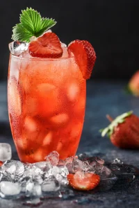 A vibrant strawberry mojito garnished with fresh strawberries and mint, served over ice by I’ll Drink To That! mobile bartending service.