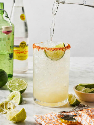 Texas Ranch Water Texas Ranch Water cocktail with tequila, fresh lime, sparkling mineral water, and a Tajín chili-lime rim served over ice